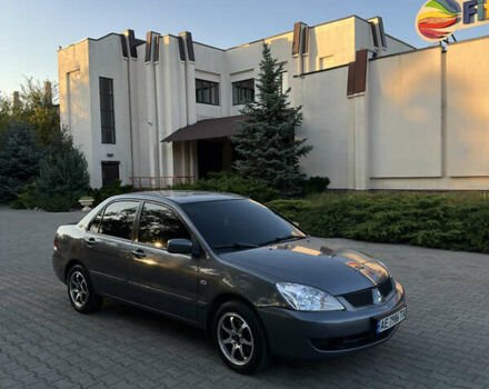 Серый Мицубиси Лансер, объемом двигателя 1.58 л и пробегом 263 тыс. км за 4099 $, фото 1 на Automoto.ua