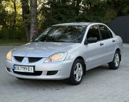 Сірий Міцубісі Lancer, об'ємом двигуна 1.58 л та пробігом 260 тис. км за 2950 $, фото 1 на Automoto.ua