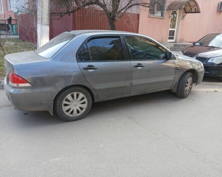 Серый Мицубиси Лансер, объемом двигателя 1 л и пробегом 266 тыс. км за 3555 $, фото 1 на Automoto.ua