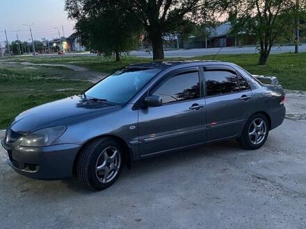 Сірий Міцубісі Lancer, об'ємом двигуна 1.6 л та пробігом 289 тис. км за 3800 $, фото 1 на Automoto.ua