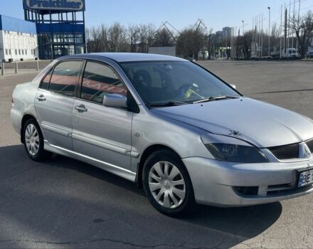 Серый Мицубиси Лансер, объемом двигателя 1.6 л и пробегом 317 тыс. км за 3300 $, фото 1 на Automoto.ua
