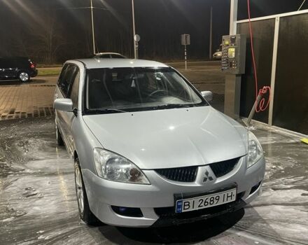 Серый Мицубиси Лансер, объемом двигателя 1.6 л и пробегом 396 тыс. км за 3250 $, фото 1 на Automoto.ua