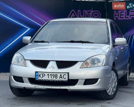 Серый Мицубиси Лансер, объемом двигателя 1.58 л и пробегом 188 тыс. км за 3799 $, фото 1 на Automoto.ua