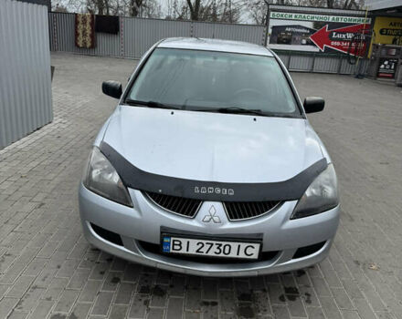 Серый Мицубиси Лансер, объемом двигателя 1.58 л и пробегом 260 тыс. км за 3500 $, фото 1 на Automoto.ua