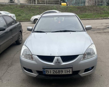 Серый Мицубиси Лансер, объемом двигателя 1.6 л и пробегом 396 тыс. км за 2900 $, фото 1 на Automoto.ua