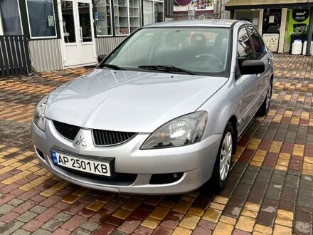 Серый Мицубиси Лансер, объемом двигателя 1.6 л и пробегом 236 тыс. км за 3800 $, фото 1 на Automoto.ua