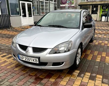 Серый Мицубиси Лансер, объемом двигателя 1.6 л и пробегом 236 тыс. км за 3800 $, фото 1 на Automoto.ua