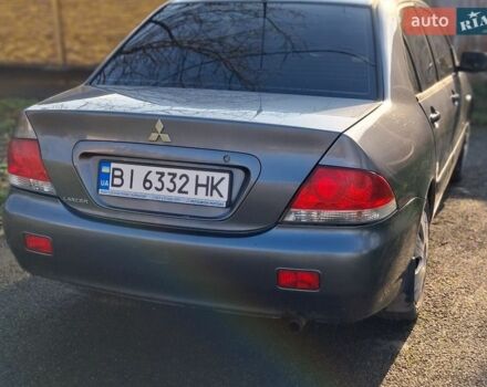 Серый Мицубиси Лансер, объемом двигателя 1.58 л и пробегом 217 тыс. км за 2800 $, фото 1 на Automoto.ua