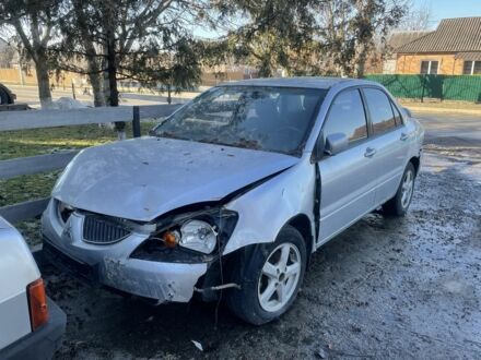 Серый Мицубиси Лансер, объемом двигателя 1.6 л и пробегом 158 тыс. км за 1200 $, фото 1 на Automoto.ua