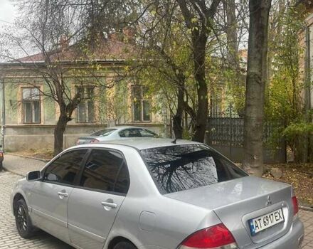 Сірий Міцубісі Lancer, об'ємом двигуна 1.58 л та пробігом 315 тис. км за 2350 $, фото 1 на Automoto.ua