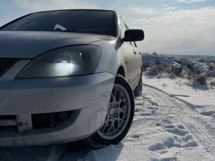 Серый Мицубиси Лансер, объемом двигателя 1.58 л и пробегом 250 тыс. км за 2900 $, фото 1 на Automoto.ua