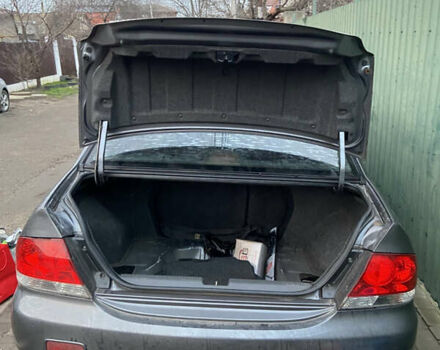 Серый Мицубиси Лансер, объемом двигателя 1.58 л и пробегом 230 тыс. км за 1400 $, фото 1 на Automoto.ua