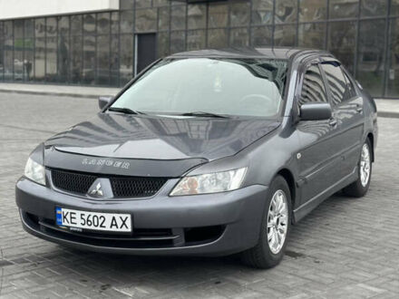 Серый Мицубиси Лансер, объемом двигателя 1.58 л и пробегом 237 тыс. км за 2999 $, фото 1 на Automoto.ua