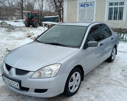 Серый Мицубиси Лансер, объемом двигателя 1.6 л и пробегом 224 тыс. км за 4000 $, фото 1 на Automoto.ua