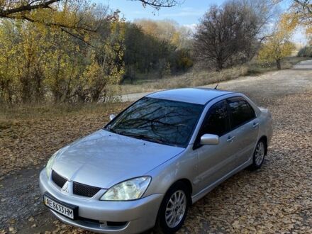 Серый Мицубиси Лансер, объемом двигателя 1.6 л и пробегом 204 тыс. км за 3999 $, фото 1 на Automoto.ua