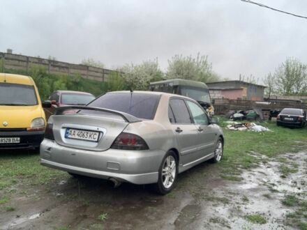 Сірий Міцубісі Lancer, об'ємом двигуна 2 л та пробігом 140 тис. км за 1400 $, фото 1 на Automoto.ua