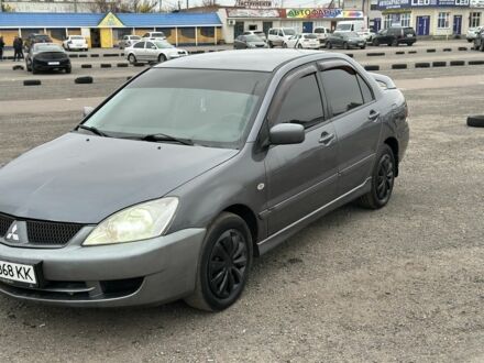 Серый Мицубиси Лансер, объемом двигателя 1.6 л и пробегом 250 тыс. км за 2550 $, фото 1 на Automoto.ua