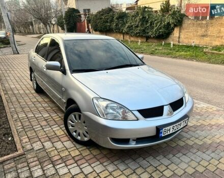 Серый Мицубиси Лансер, объемом двигателя 1.6 л и пробегом 154 тыс. км за 4500 $, фото 1 на Automoto.ua