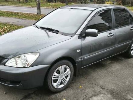 Серый Мицубиси Лансер, объемом двигателя 1.6 л и пробегом 263 тыс. км за 3800 $, фото 1 на Automoto.ua