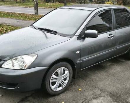 Серый Мицубиси Лансер, объемом двигателя 1.6 л и пробегом 263 тыс. км за 3800 $, фото 1 на Automoto.ua