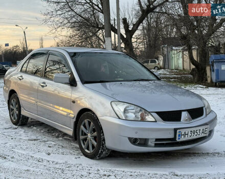 Серый Мицубиси Лансер, объемом двигателя 1.58 л и пробегом 244 тыс. км за 4800 $, фото 1 на Automoto.ua