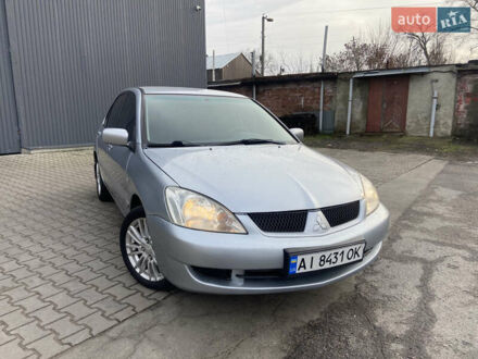Сірий Міцубісі Lancer, об'ємом двигуна 1.6 л та пробігом 261 тис. км за 5100 $, фото 1 на Automoto.ua