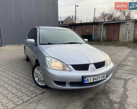 Сірий Міцубісі Lancer, об'ємом двигуна 1.6 л та пробігом 261 тис. км за 5100 $, фото 1 на Automoto.ua