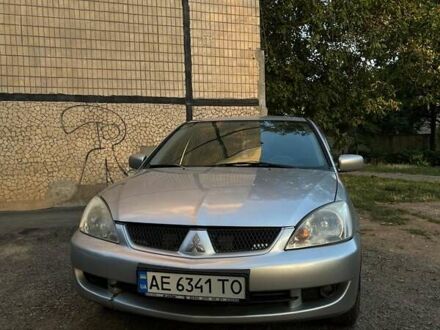 Серый Мицубиси Лансер, объемом двигателя 1.6 л и пробегом 225 тыс. км за 4200 $, фото 1 на Automoto.ua