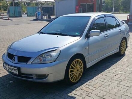 Серый Мицубиси Лансер, объемом двигателя 1.58 л и пробегом 265 тыс. км за 2900 $, фото 1 на Automoto.ua