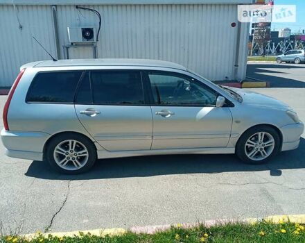 Серый Мицубиси Лансер, объемом двигателя 2 л и пробегом 242 тыс. км за 3600 $, фото 1 на Automoto.ua