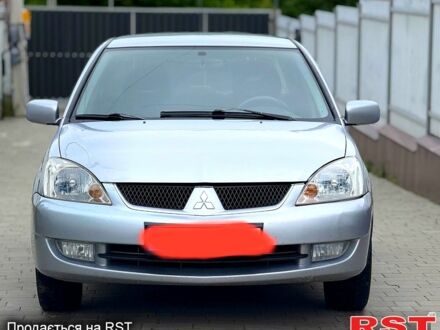 Серый Мицубиси Лансер, объемом двигателя 1.6 л и пробегом 200 тыс. км за 4000 $, фото 1 на Automoto.ua