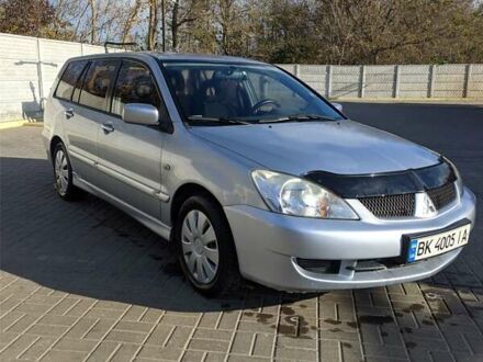 Сірий Міцубісі Lancer, об'ємом двигуна 1.58 л та пробігом 220 тис. км за 4499 $, фото 1 на Automoto.ua