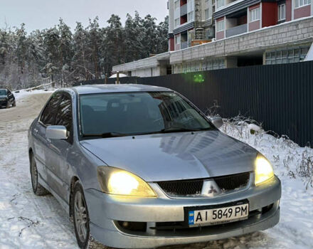 Серый Мицубиси Лансер, объемом двигателя 2 л и пробегом 204 тыс. км за 5300 $, фото 1 на Automoto.ua