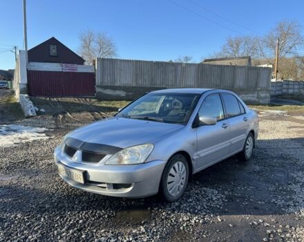 Серый Мицубиси Лансер, объемом двигателя 1.6 л и пробегом 220 тыс. км за 3300 $, фото 1 на Automoto.ua