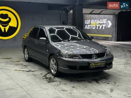 Сірий Міцубісі Lancer, об'ємом двигуна 1.58 л та пробігом 300 тис. км за 4600 $, фото 1 на Automoto.ua