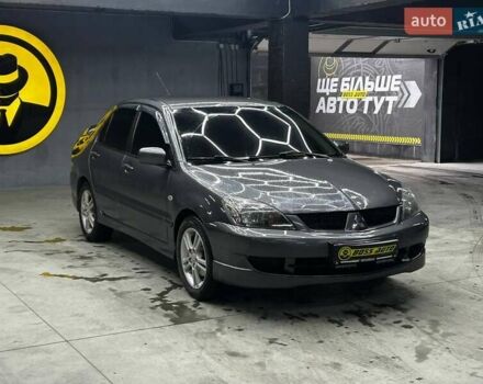 Серый Мицубиси Лансер, объемом двигателя 1.58 л и пробегом 300 тыс. км за 4600 $, фото 1 на Automoto.ua