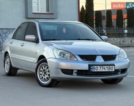 Серый Мицубиси Лансер, объемом двигателя 1.58 л и пробегом 300 тыс. км за 2550 $, фото 1 на Automoto.ua