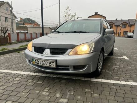 Серый Мицубиси Лансер, объемом двигателя 1.6 л и пробегом 333 тыс. км за 2800 $, фото 1 на Automoto.ua