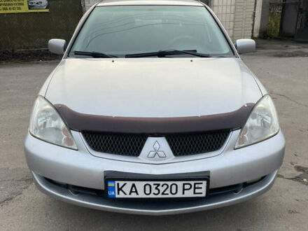 Серый Мицубиси Лансер, объемом двигателя 1.58 л и пробегом 430 тыс. км за 2550 $, фото 1 на Automoto.ua