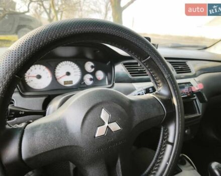 Серый Мицубиси Лансер, объемом двигателя 1.6 л и пробегом 234 тыс. км за 4300 $, фото 1 на Automoto.ua