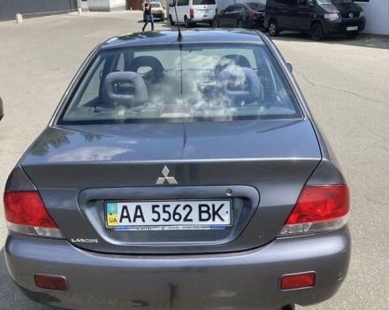 Сірий Міцубісі Lancer, об'ємом двигуна 1.58 л та пробігом 263 тис. км за 3500 $, фото 1 на Automoto.ua