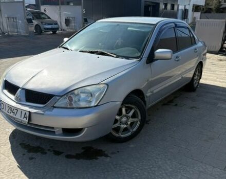 Серый Мицубиси Лансер, объемом двигателя 1.58 л и пробегом 307 тыс. км за 3600 $, фото 1 на Automoto.ua