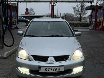 Серый Мицубиси Лансер, объемом двигателя 2 л и пробегом 256 тыс. км за 7000 $, фото 1 на Automoto.ua