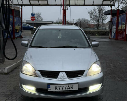 Серый Мицубиси Лансер, объемом двигателя 2 л и пробегом 256 тыс. км за 7000 $, фото 1 на Automoto.ua