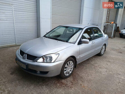 Серый Мицубиси Лансер, объемом двигателя 1.58 л и пробегом 215 тыс. км за 4000 $, фото 1 на Automoto.ua