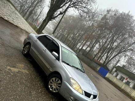 Серый Мицубиси Лансер, объемом двигателя 1.6 л и пробегом 123 тыс. км за 4000 $, фото 1 на Automoto.ua