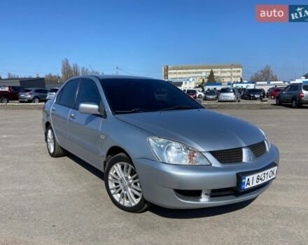 Серый Мицубиси Лансер, объемом двигателя 1.6 л и пробегом 261 тыс. км за 5100 $, фото 1 на Automoto.ua