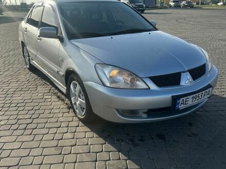 Серый Мицубиси Лансер, объемом двигателя 1.6 л и пробегом 170 тыс. км за 3700 $, фото 1 на Automoto.ua