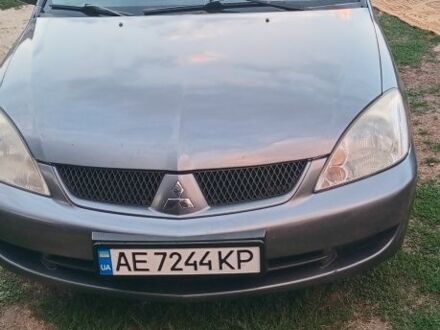 Серый Мицубиси Лансер, объемом двигателя 1.6 л и пробегом 270 тыс. км за 3700 $, фото 1 на Automoto.ua