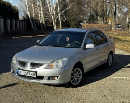 Серый Мицубиси Лансер, объемом двигателя 1.6 л и пробегом 220 тыс. км за 3900 $, фото 1 на Automoto.ua